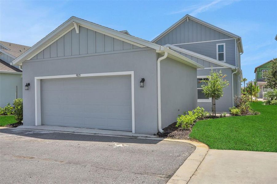 Front exterior of a new home in Bungalow Walk at Lakewood Ranch, Lakewood Ranch, FL, highlighting curb appeal (Image 14).