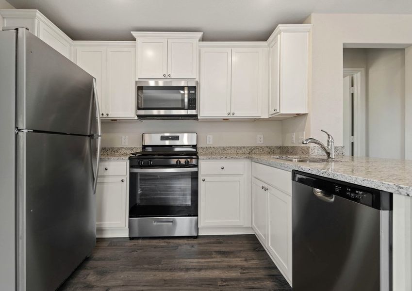 Kitchen with white countertops and granite countertops