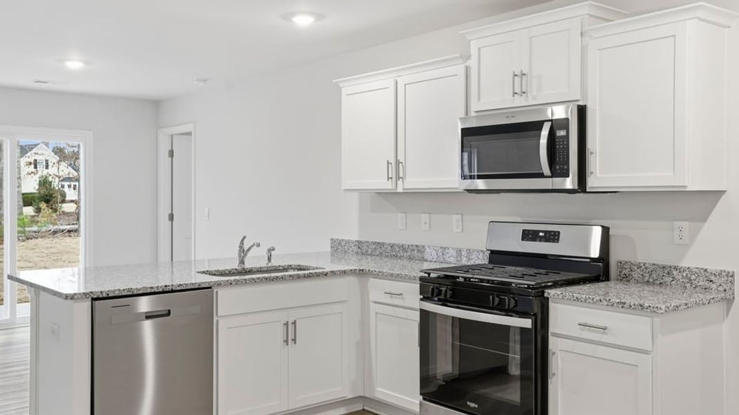 Furnished interior view inside a new home in Bentley Park, Greenwood (Image 7).