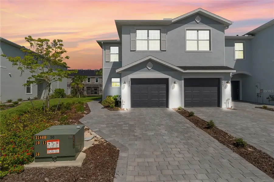 Front exterior of a new home in , Punta Gorda, FL, highlighting curb appeal (Image 23).