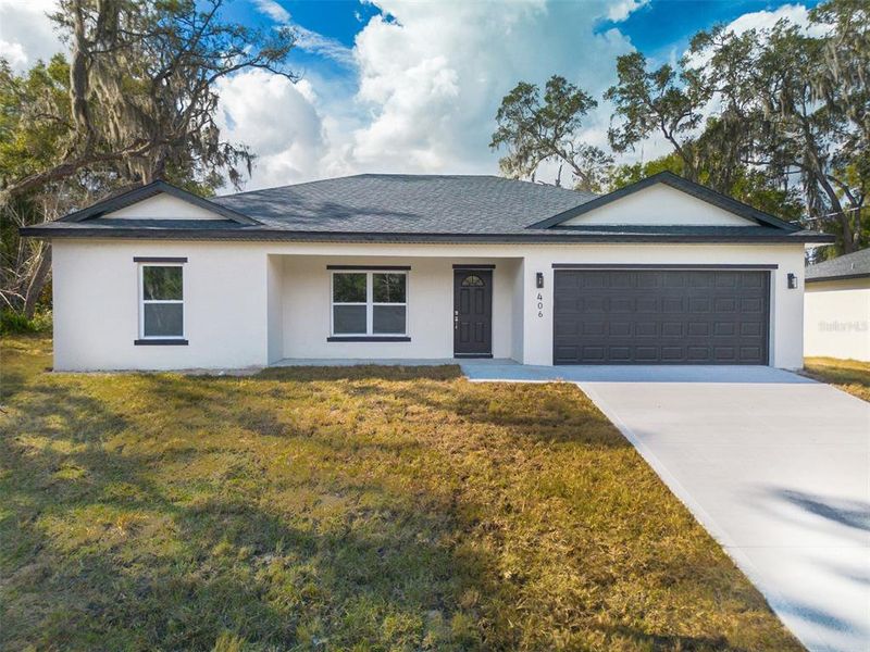Front exterior of a new home in , Deland, FL, highlighting curb appeal (Image 12).