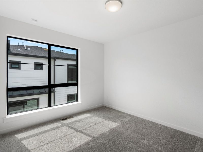 Spacious, unfurnished interior of a new home in The Commons at Victory Ridge, Colorado Springs (Image 9).