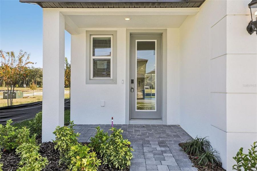 Exterior details and patio area of a home in The Reserve at Hammock Oaks - Classic Series, Lady Lake (Image 3).