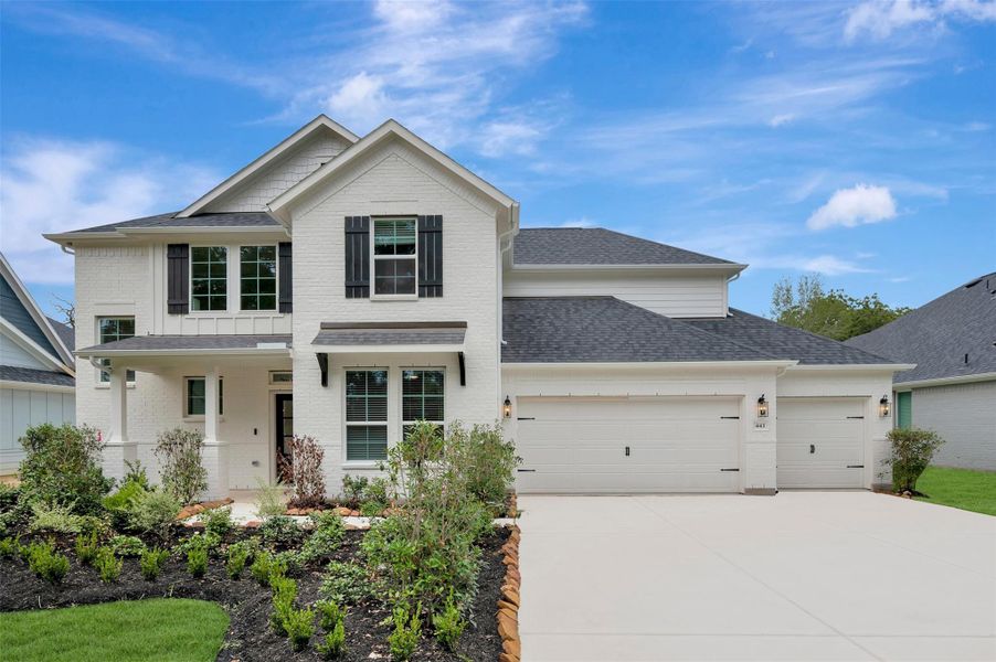 Front exterior of a new home in The Oaks on 6th Street, Magnolia, TX, highlighting curb appeal (Image 16).