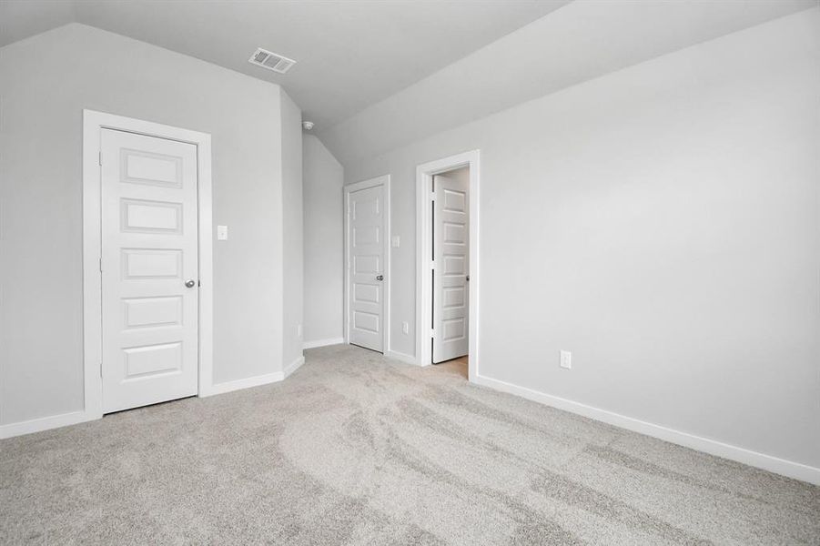 Generously sized secondary bedrooms, complete with spacious closets and soft, inviting carpeting. Sample photo, actual color and selections can vary.