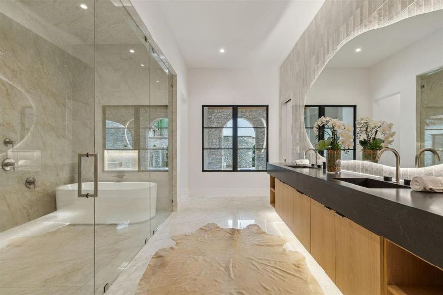 Spacious Bath oasis with designer mirrors and lighting, built-in cabinetry, lighting under cabinetry, duel shower, Hollywood soaking tub, and tile floors Spacious Bath oasis with designer mirrors and lighting, built-in cabinetry, lighting under cabinetry, duel shower, Hollywood soaking tub, and tile floors