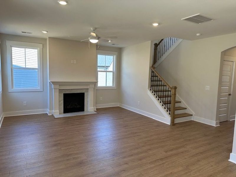 This inviting space features warm flooring, a char