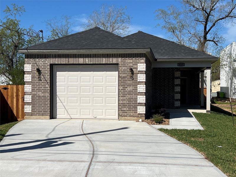 Front exterior of a new home in , Richmond, TX, highlighting curb appeal (Image 30).