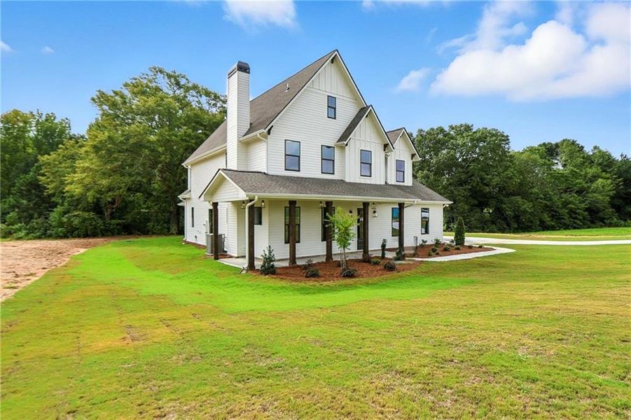 Front exterior of a new home in Old Town Estates, Dacula, GA, highlighting curb appeal (Image 37).
