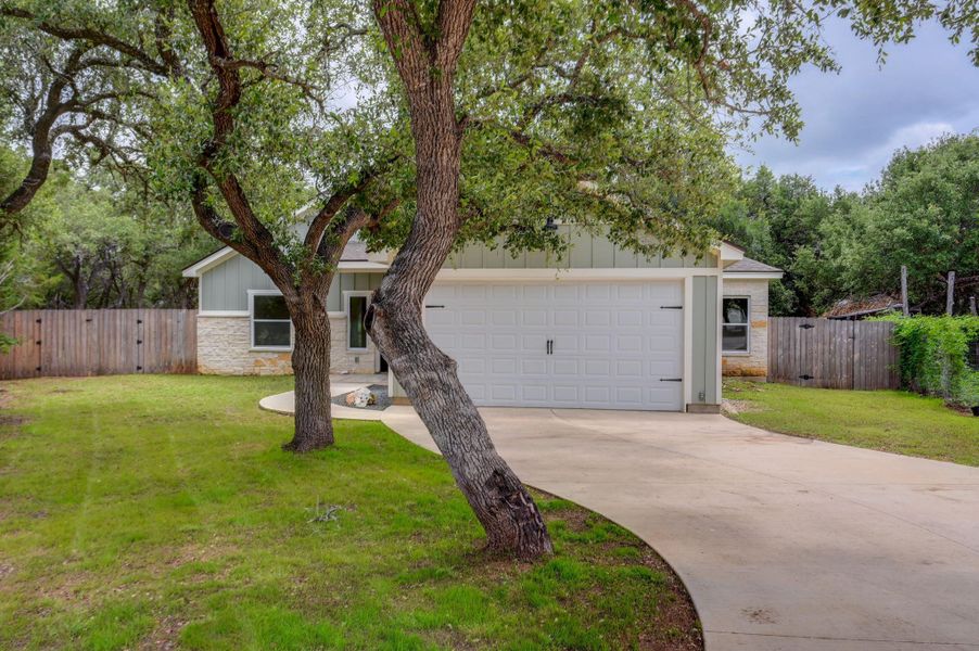 A welcoming patio extends to a spacious yard, with plenty of space for a fire pit and play area for diverse outdoor enjoyment. A welcoming patio extends to a spacious yard, with plenty of space for a fire pit and play area for diverse outdoor enjoyment.