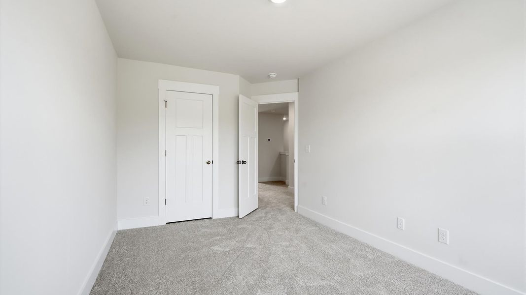 Thoughtfully designed rooms with plush carpeting and generous proportions by DRB Homes