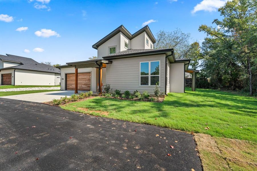 Front exterior of a new home in , Lindale, TX, highlighting curb appeal (Image 24). Front exterior of a new home in , Lindale, TX, highlighting curb appeal (Image 24).