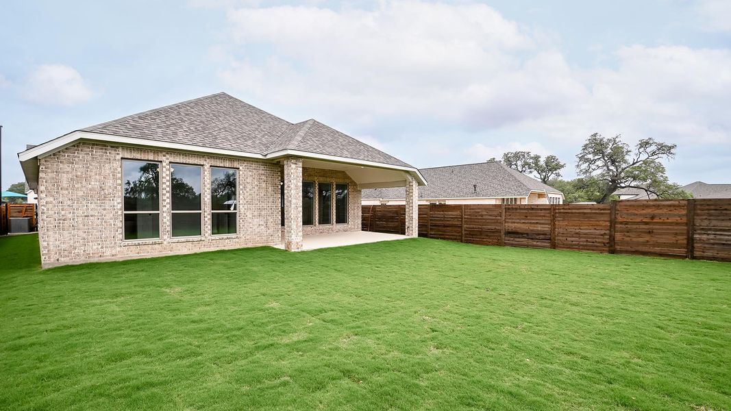 Exterior details and patio area of a home in Juniper Springs, Lockhart (Image 3).