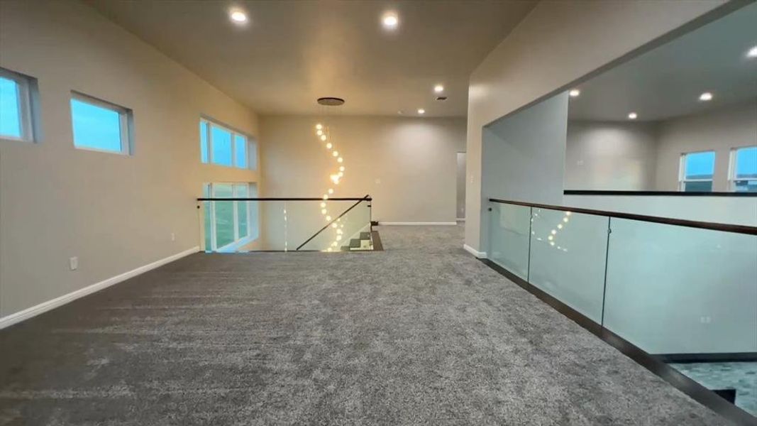 Spare room with carpet and recessed lighting