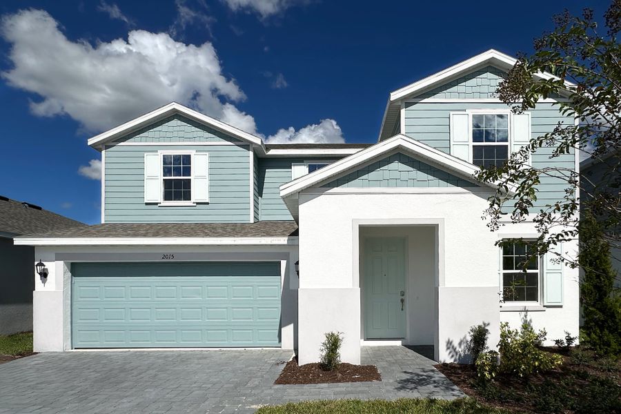 Front exterior of a new home in Trinity Gardens, Deland, FL, highlighting curb appeal (Image 6).