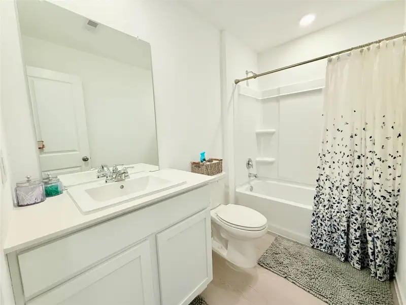 Secondary bathroom offers a spacious shower-tub combo perfect for relaxation and a big vanity with lots of storage space. Secondary bathroom offers a spacious shower-tub combo perfect for relaxation and a big vanity with lots of storage space.