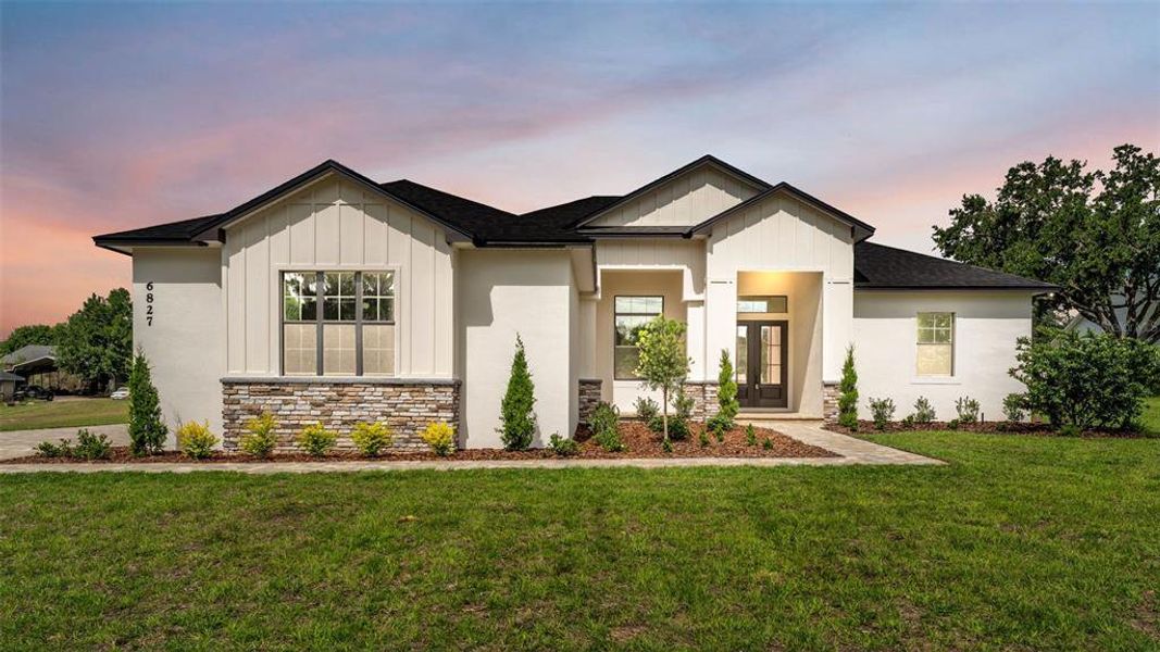 Front exterior of a new home in , Lakeland, FL, highlighting curb appeal (Image 26).