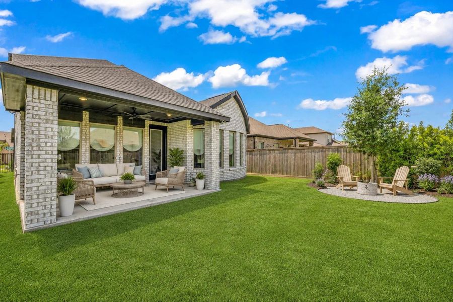 This expansive lawn and covered patio offer a backyard with full potential, perfect for creating a future fire pit area for family gatherings or customizing the space entirely to your lifestyle.**Virtually staged This expansive lawn and covered patio offer a backyard with full potential, perfect for creating a future fire pit area for family gatherings or customizing the space entirely to your lifestyle.**Virtually staged