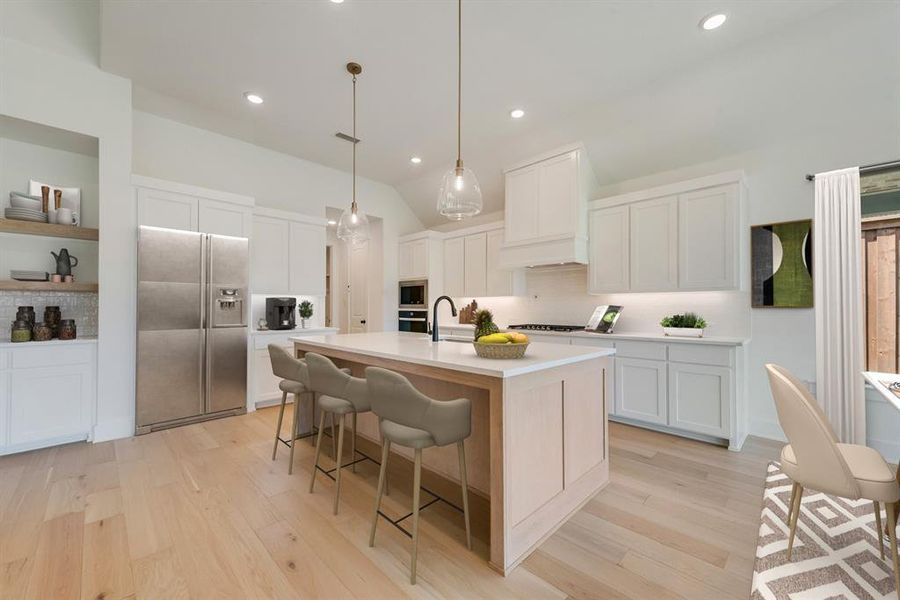 Kitchen with tasteful backsplash, stainless steel appliances, white cabinets, recessed lighting, and lofted ceiling