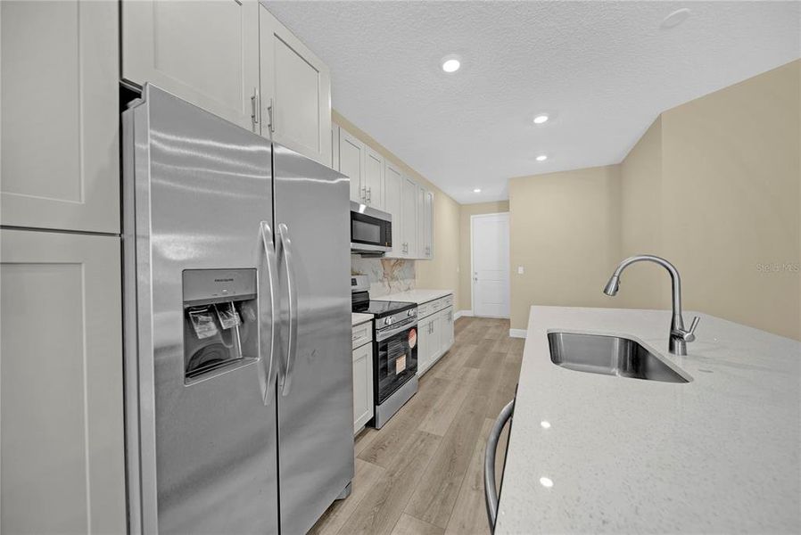 Furnished interior view inside a new home in , Winter Garden (Image 11).