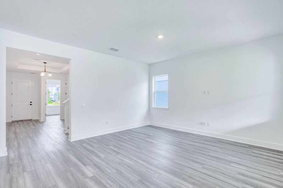 Representative unfurnished interior of a home built from the Faulkner by Rockwell Homes in Northlake At Ovation, Winter Garden (Image 25).