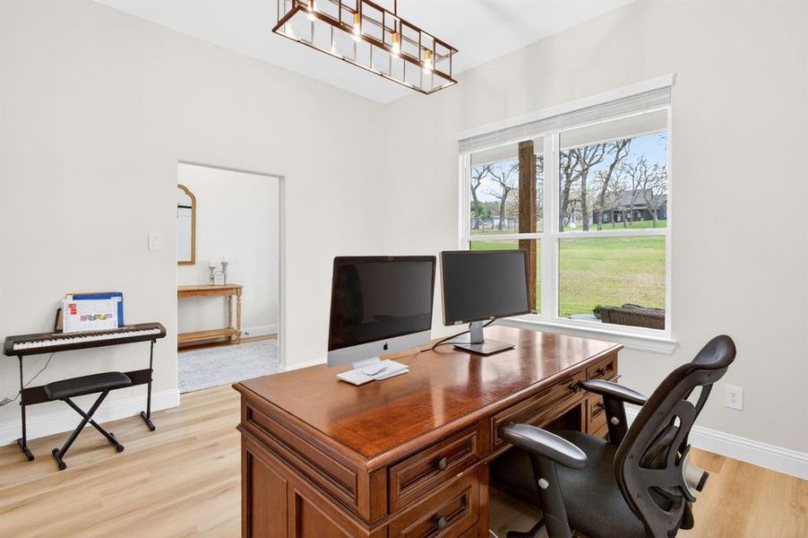 Office space featuring light wood-type flooring and baseboards Office space featuring light wood-type flooring and baseboards