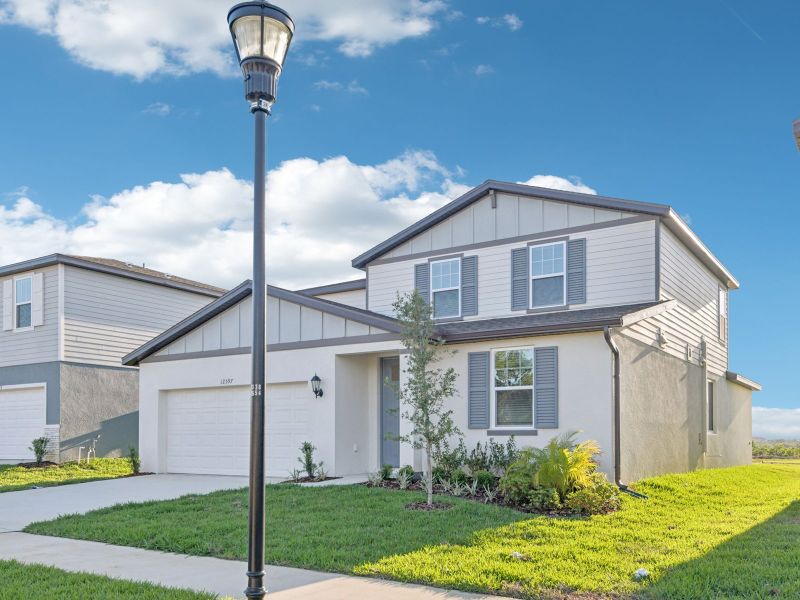Front exterior of a new home in Hilltop Vistas, Dade City, FL, highlighting curb appeal (Image 2). Front exterior of a new home in Hilltop Vistas, Dade City, FL, highlighting curb appeal (Image 2).