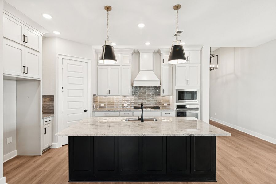 Furnished interior view inside a new home in Elyson 45', Katy (Image 6).