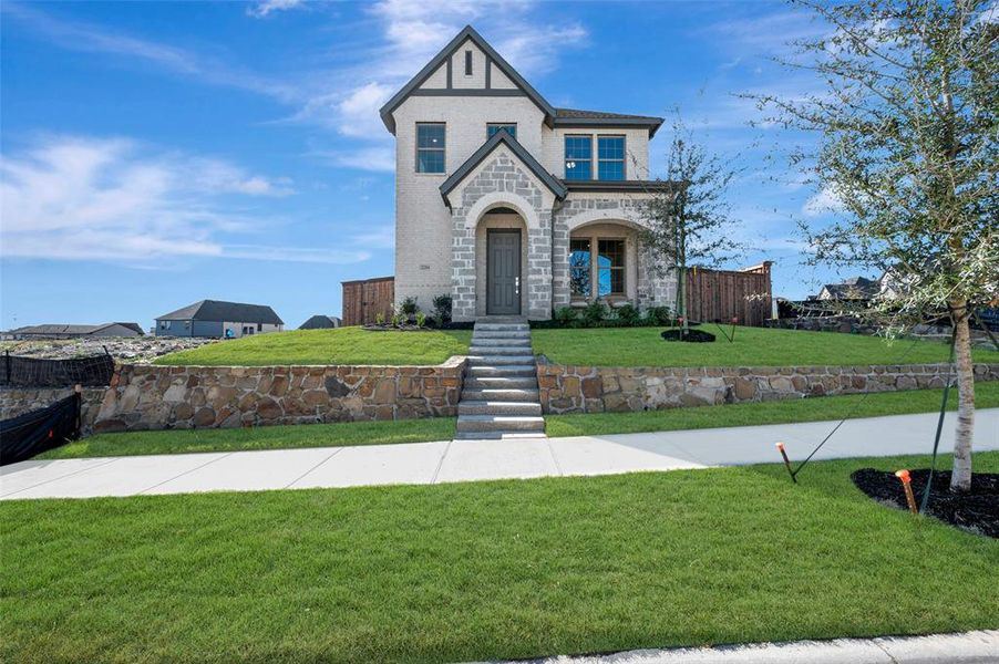 Front exterior of a new home in Walsh Cottage, Fort Worth, TX, highlighting curb appeal (Image 1). Front exterior of a new home in Walsh Cottage, Fort Worth, TX, highlighting curb appeal (Image 1).