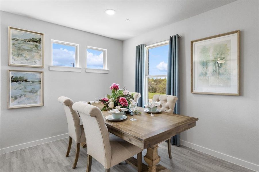 Dining space featuring plenty of natural light and light wood-type flooring