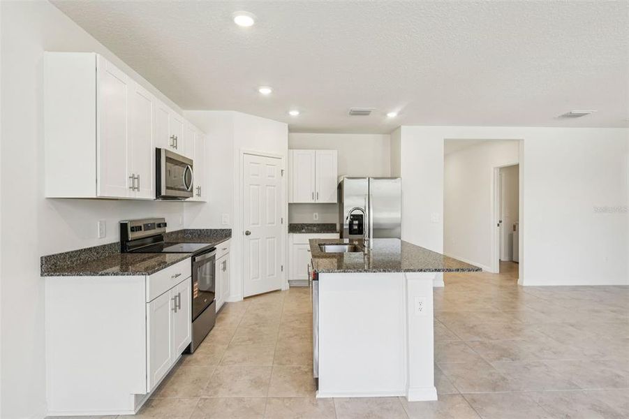 Furnished interior view inside a new home in Bradbury Creek - Signature Series, Haines City (Image 6).