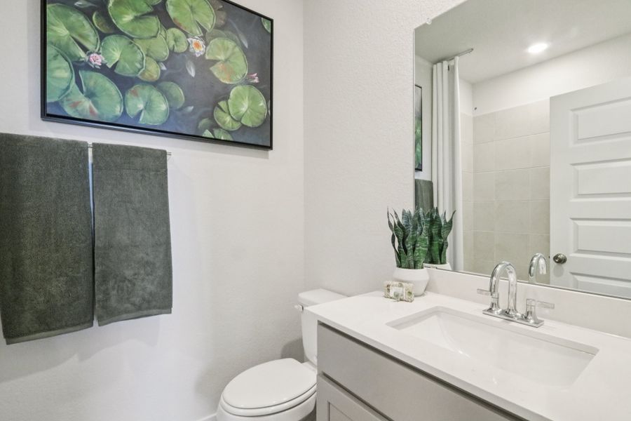 A bathroom with a sink and a toilet. A bathroom with a sink and a toilet.