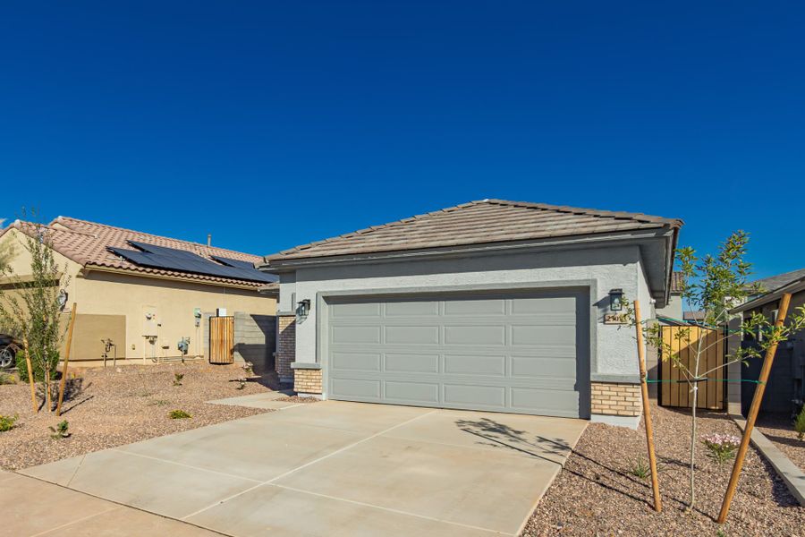 Front exterior of a new home in Sunrise, Surprise, AZ, highlighting curb appeal (Image 16).