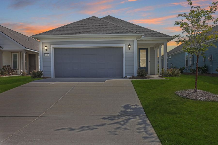 Front exterior of a new home in Del Webb Charleston at Nexton, Summerville, SC, highlighting curb appeal (Image 1). Front exterior of a new home in Del Webb Charleston at Nexton, Summerville, SC, highlighting curb appeal (Image 1).