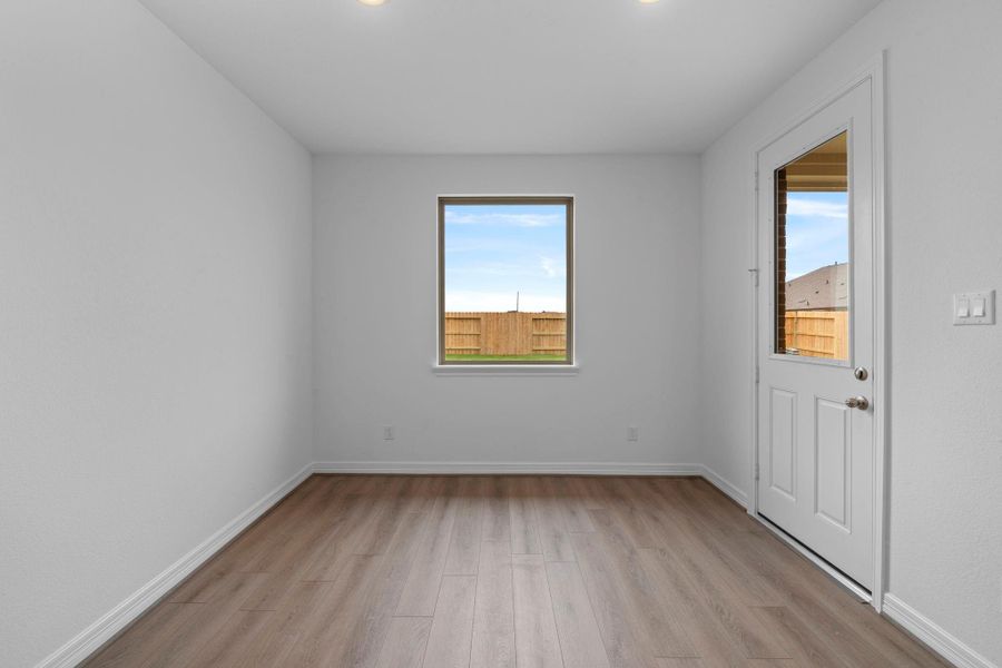 With an abundance of natural light streaming through the windows, the breakfast nook is bathed in a sunny glow, creating the perfect atmosphere to enjoy your morning coffee or a family breakfast.