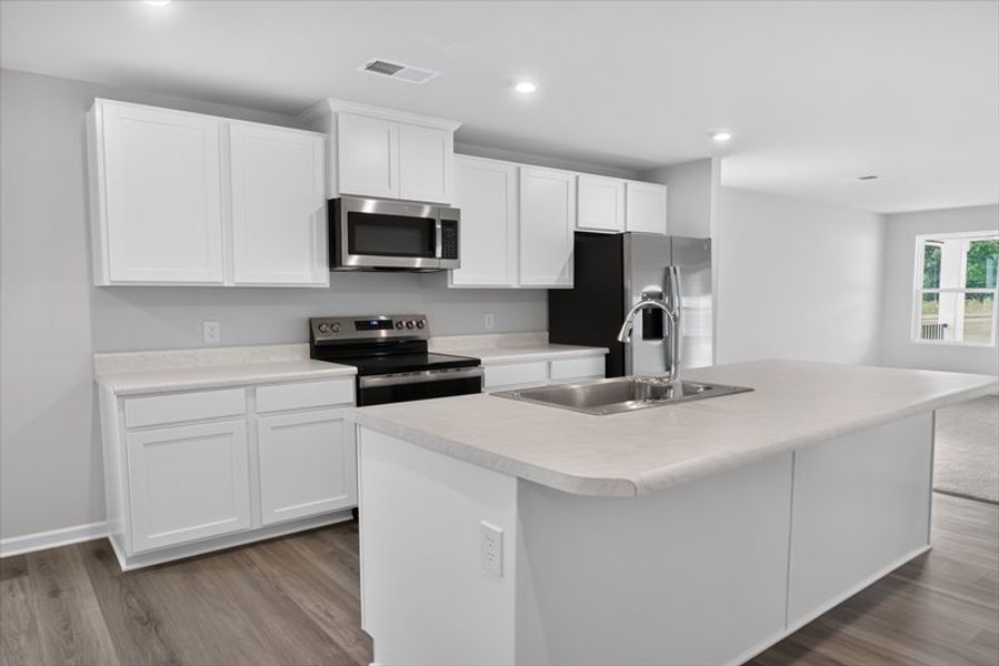 Furnished interior view inside a new home in Wren Woods 2-Story, Gray Court (Image 4).