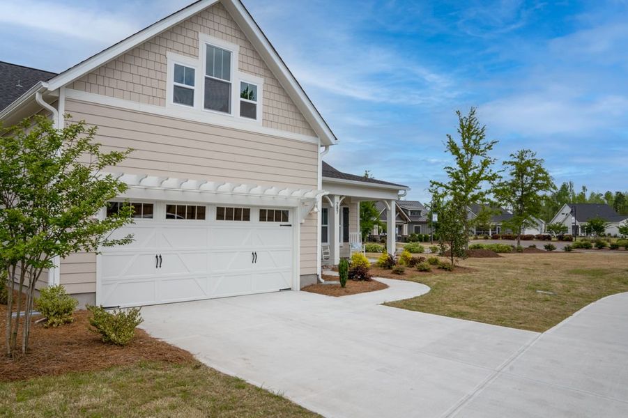 Representative exterior photo of a completed home built from the Ashton by Bill Clark Homes in Osprey Landing, Southport, NC (Image 31). Representative exterior photo of a completed home built from the Ashton by Bill Clark Homes in Osprey Landing, Southport, NC (Image 31).