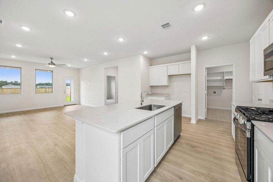 Kitchen in the Magnolia home plan by Trophy Signature Homes – REPRESENTATIVE PHOTO Kitchen in the Magnolia home plan by Trophy Signature Homes – REPRESENTATIVE PHOTO