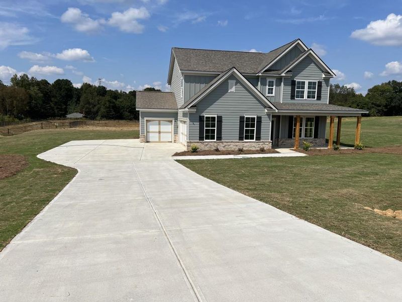 Front exterior of a new home in , Good Hope, GA, highlighting curb appeal (Image 29). Front exterior of a new home in , Good Hope, GA, highlighting curb appeal (Image 29).