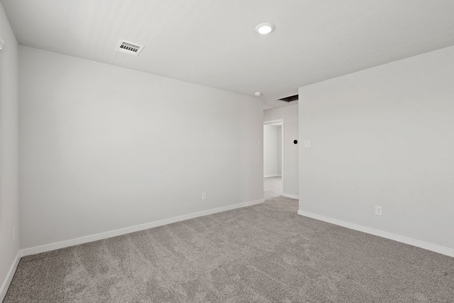 A hallway with white walls.