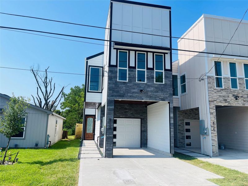 Front exterior of a new home in , Houston, TX, highlighting curb appeal (Image 23).