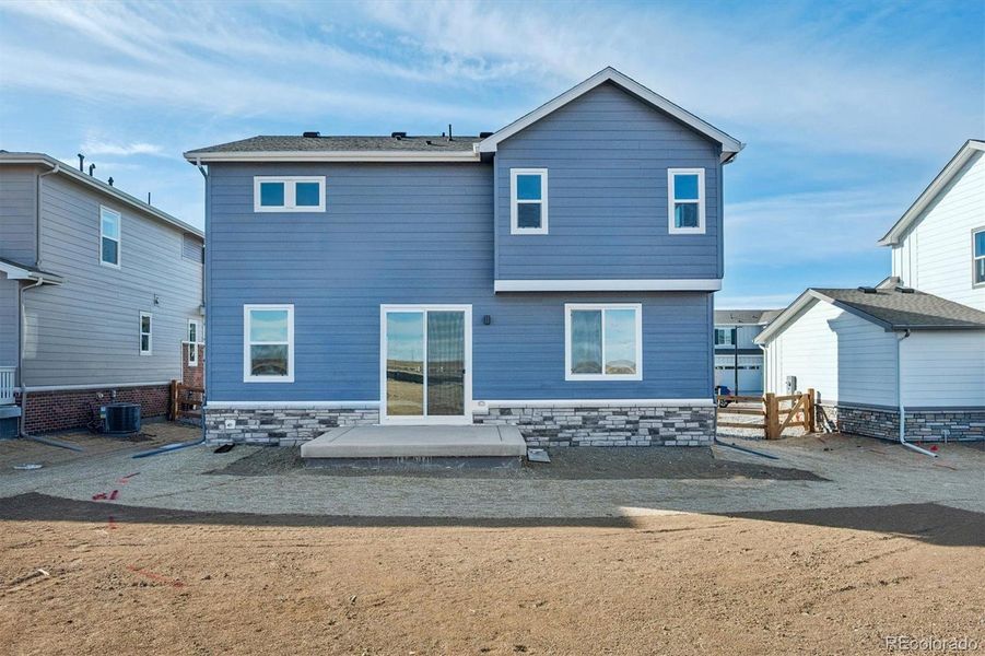 Exterior details and patio area of a home in The Aurora Highlands, Aurora (Image 3).