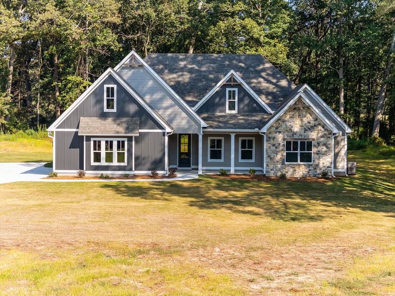 Front exterior of a new home in LOVVORN ESTATES, Carrollton, GA, highlighting curb appeal (Image 24).