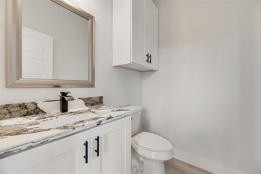 Bathroom featuring vanity and light wood-style flooring