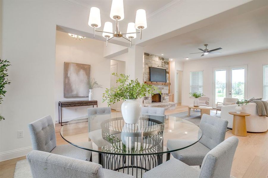 Spacious dining area with chandelier.