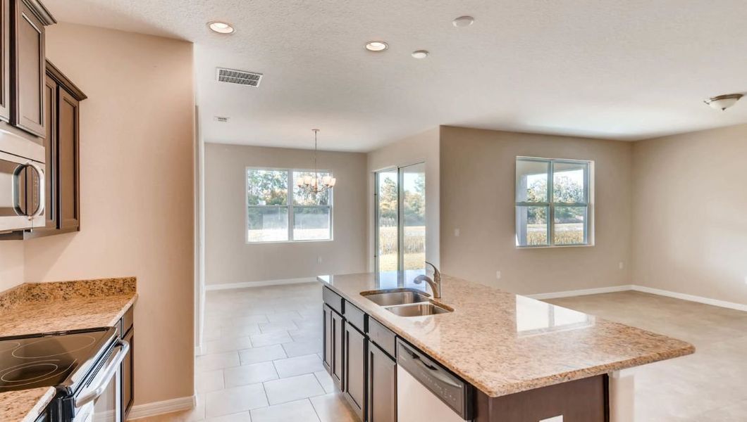 Furnished interior in a model home at Preserves at Lakeside Landings in Winter Haven (Image 42).