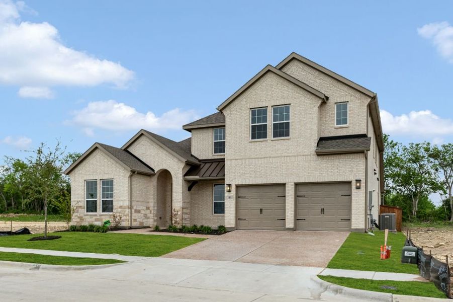 Representative exterior photo of a completed home built from the The Whitney by UnionMain Homes in Cambridge Crossing, Celina, TX (Image 27).