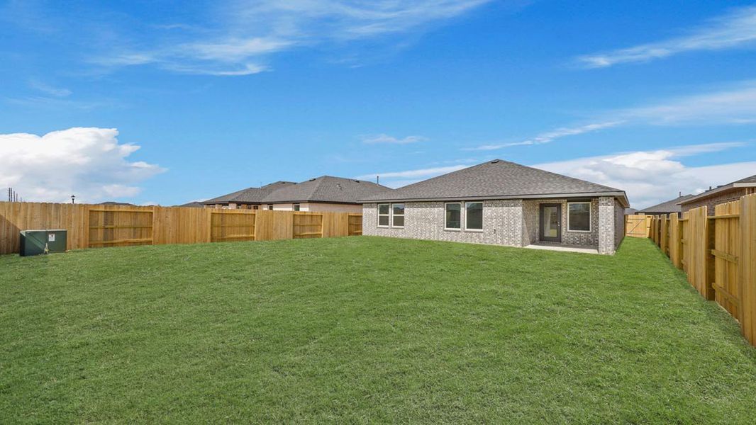 Exterior details and patio area of a home in Sunterra, Katy (Image 4).