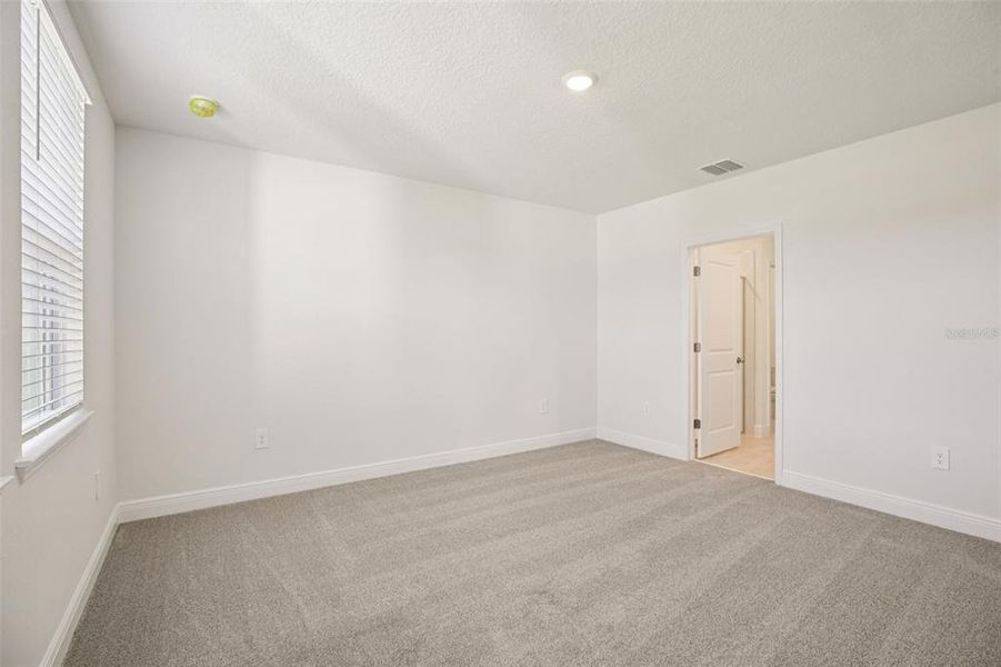 Spacious, unfurnished interior of a new home in The Reserve at Hammock Oaks - Classic Series, Lady Lake (Image 31).