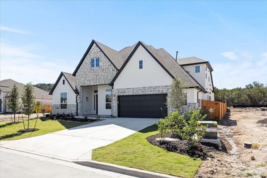 Front exterior of a new home in Sweetwater, Austin, TX, highlighting curb appeal (Image 26).